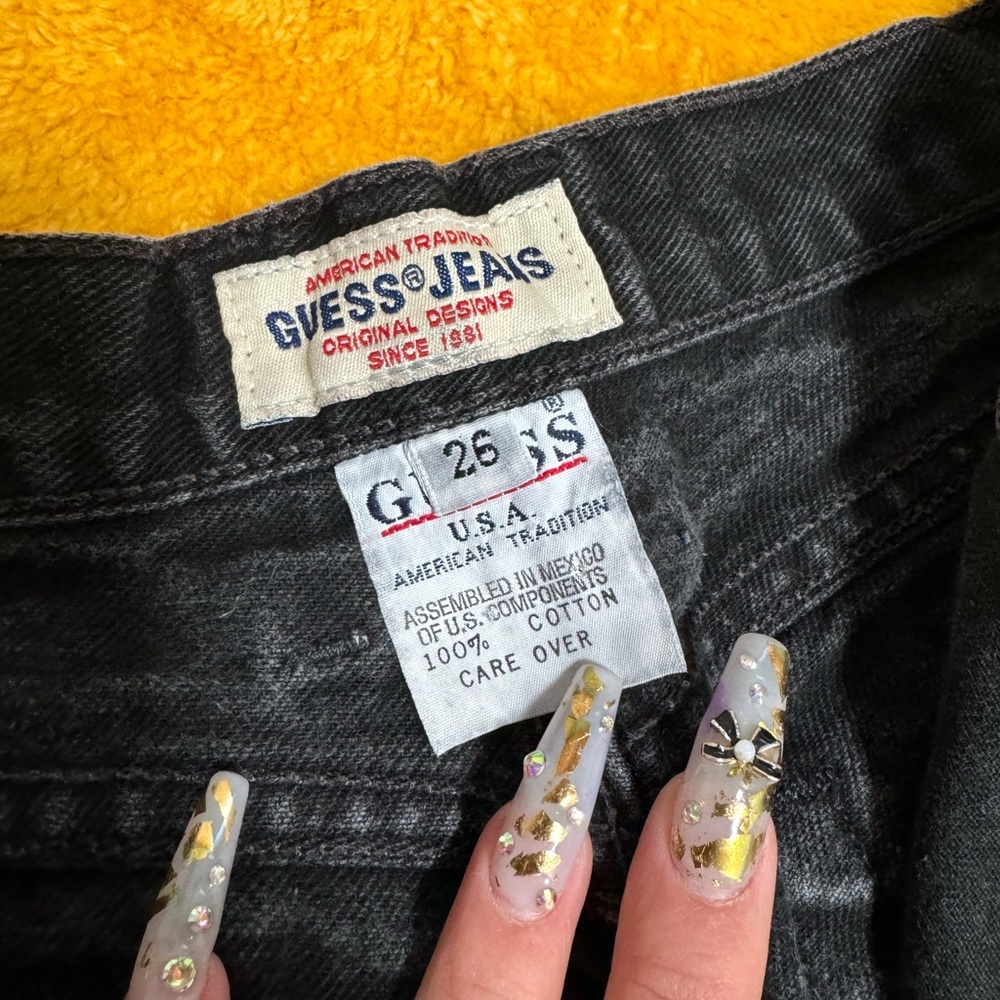 Black, high waisted, straight legged vintage guest jeans